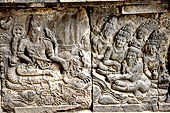 Prambanan - Ramayana reliefs. Opening scene from Ramayna relief series: Vishnu, in the central panel, with adoring Garuda to his right, and five supplicants to his left, on inner side of balustrade of Shiva temple.  